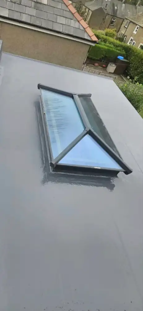 Flat roof with skylight by Kings Roofing